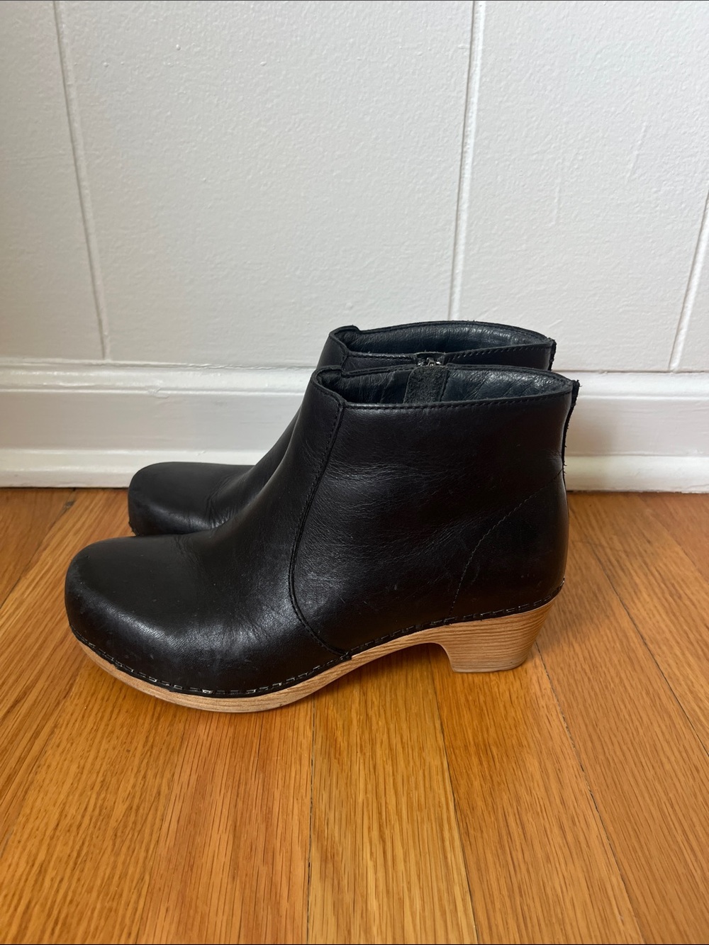 Dansko Black Leather Ankle Booties with Wood-Look Heel